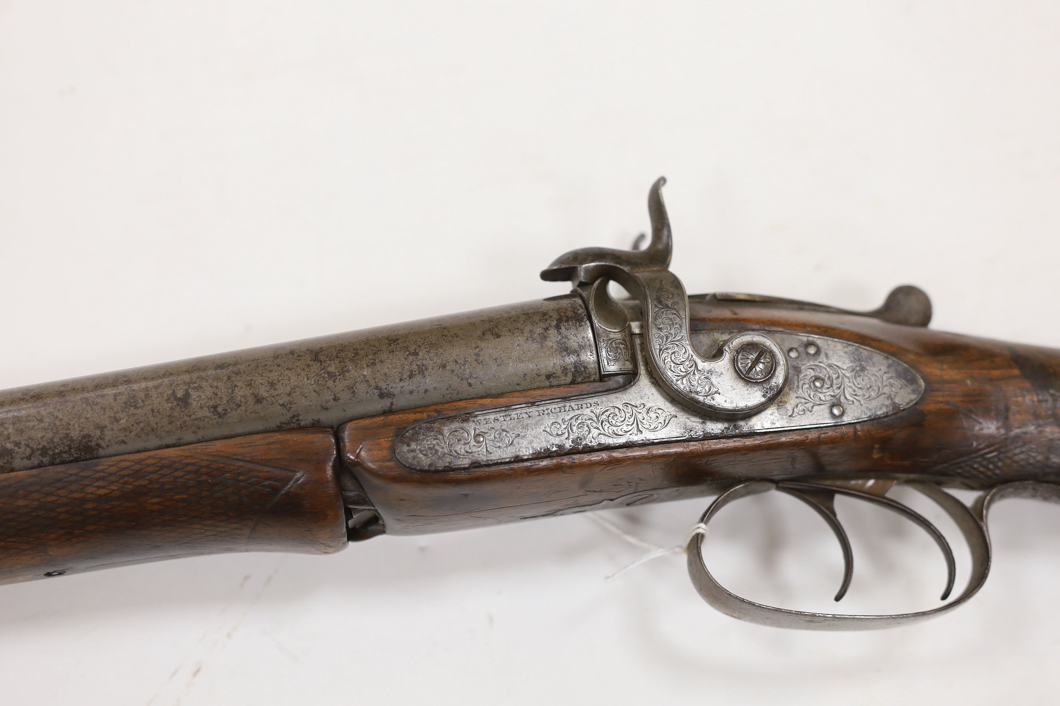 A double barrel pinfire shotgun by Wesley Richards with patent knuckle joint and top lever, barrels 74.5cm